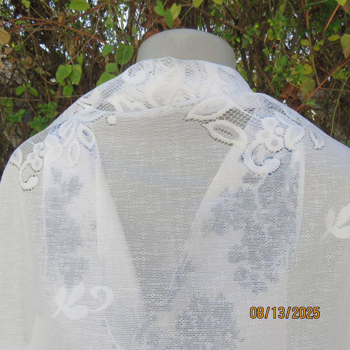 White sheer polyester triangle shawl with scalloped fringed edging. New