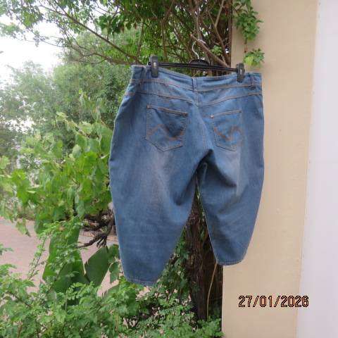 Blue denim just under knee length jeans in polycotton stretch. Size 42 to 44