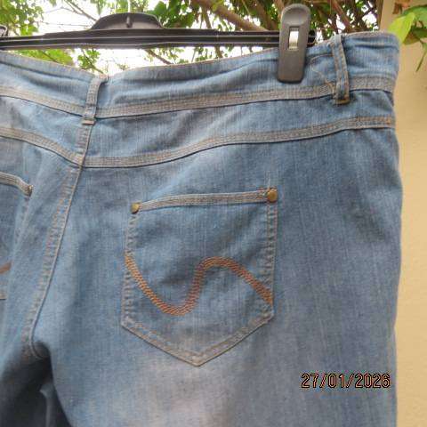 Blue denim just under knee length jeans in polycotton stretch. Size 42 to 44