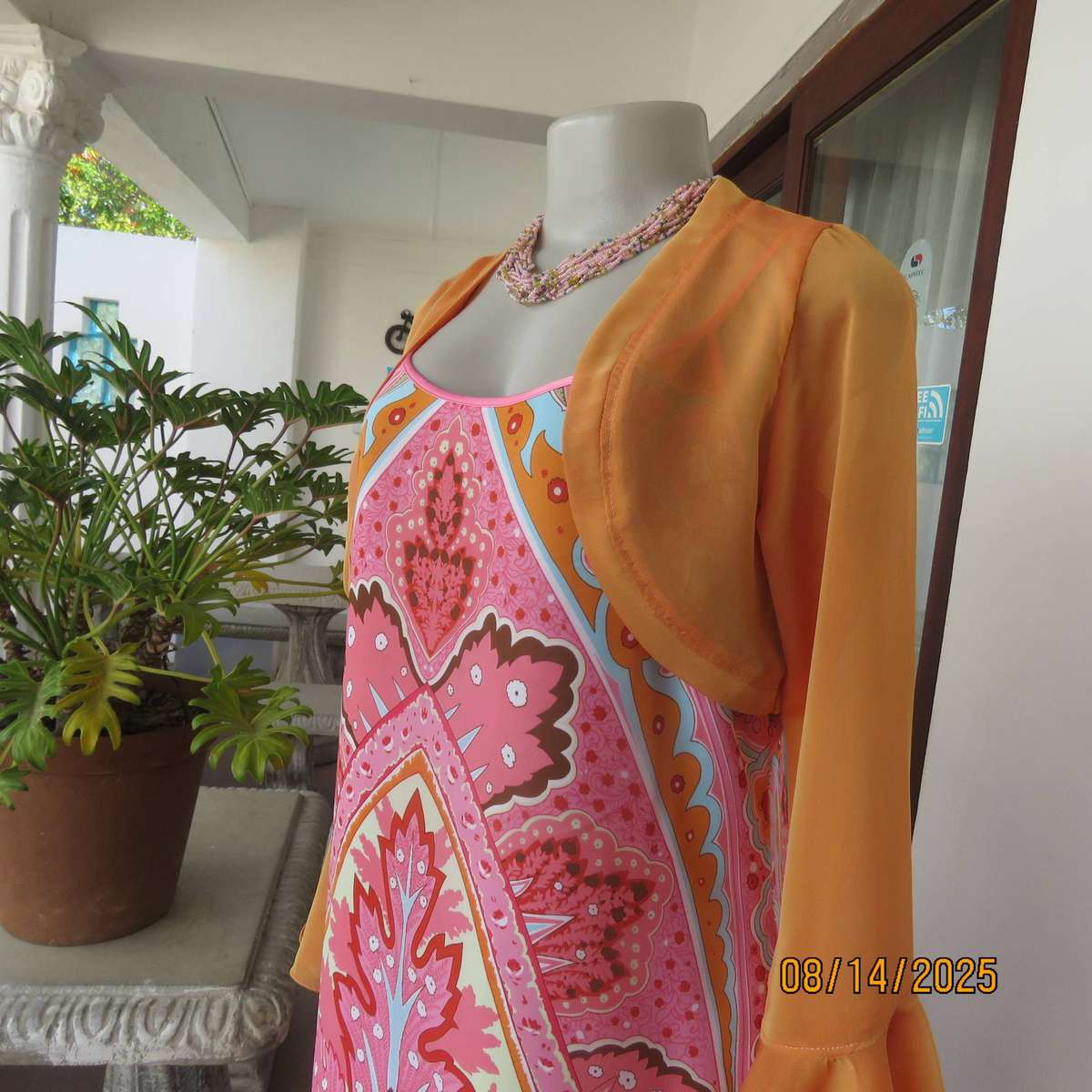 Tangerine boutique made long sleeve shiny polyester bolero. Flare cuffs. Size 34-36