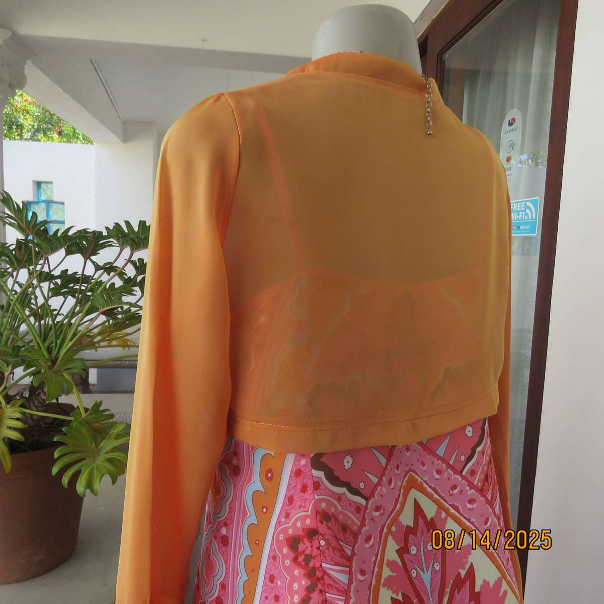 Tangerine boutique made long sleeve shiny polyester bolero. Flare cuffs. Size 34-36