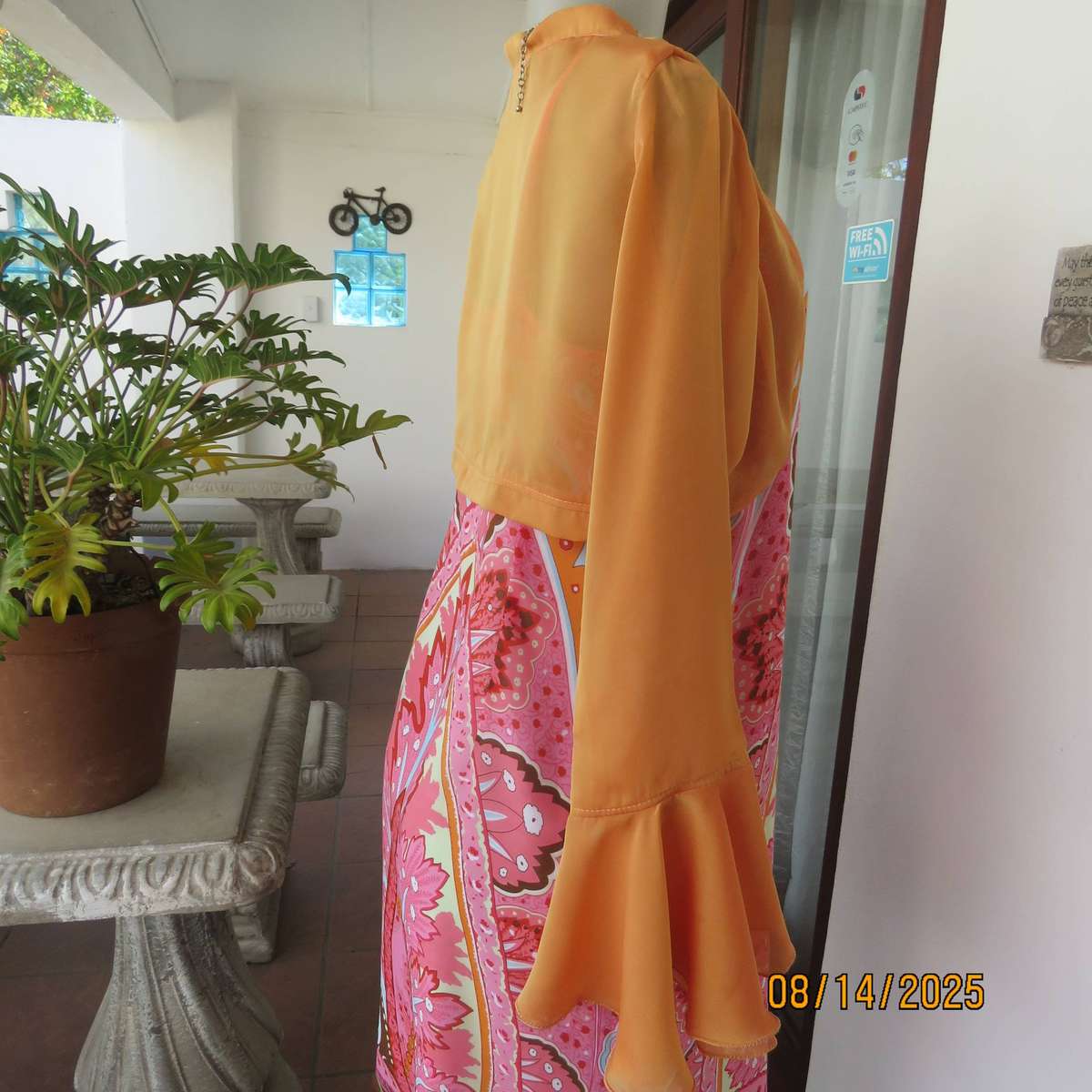 Tangerine boutique made long sleeve shiny polyester bolero. Flare cuffs. Size 34-36