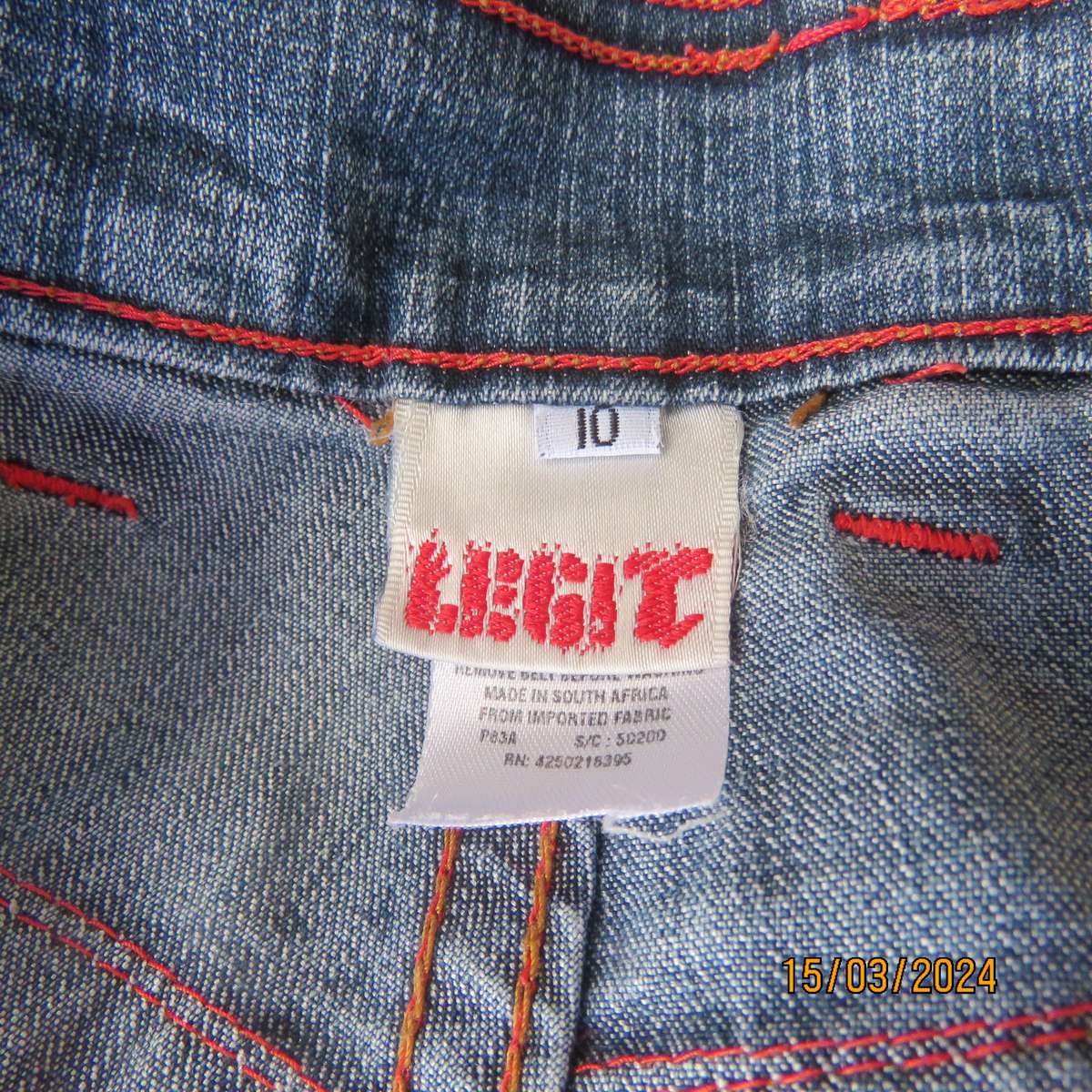 LEGIT light fit size 34 blue denim stretch cotton jeans. Bootlegged.