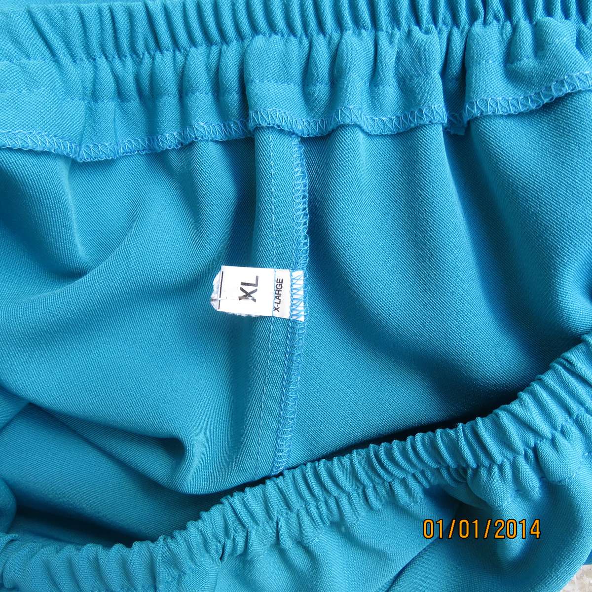 Smart turquoise comfy heavy polyester pants size 46-48. Elasticated waist.