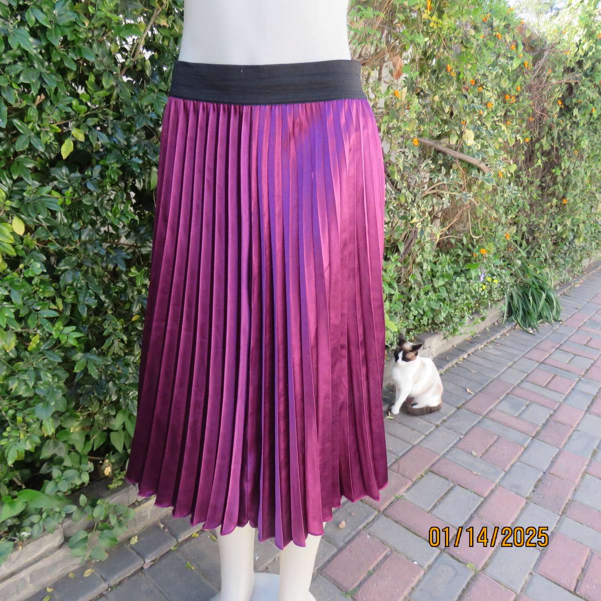 Amazing plum colour silky polyester perm. concertina pleated skirt.Black elastic waistband.Size 36