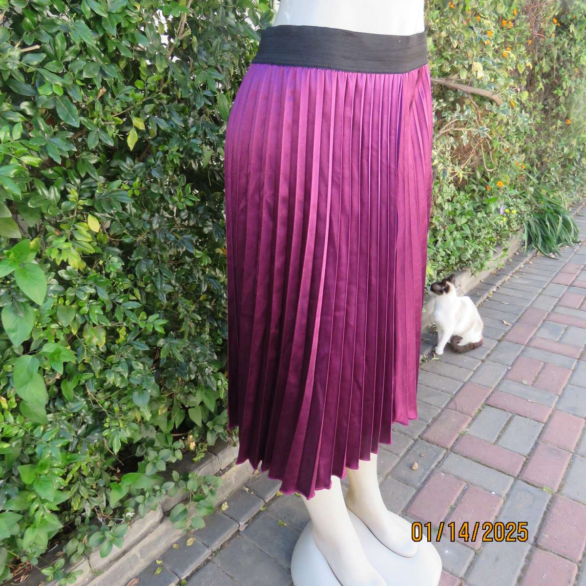 Amazing plum colour silky polyester perm. concertina pleated skirt.Black elastic waistband.Size 36