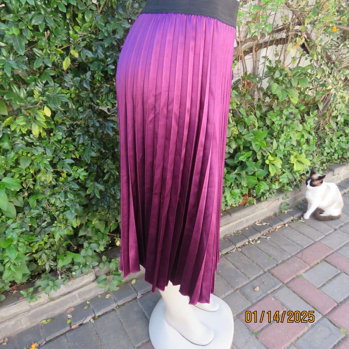 Amazing plum colour silky polyester perm. concertina pleated skirt.Black elastic waistband.Size 36