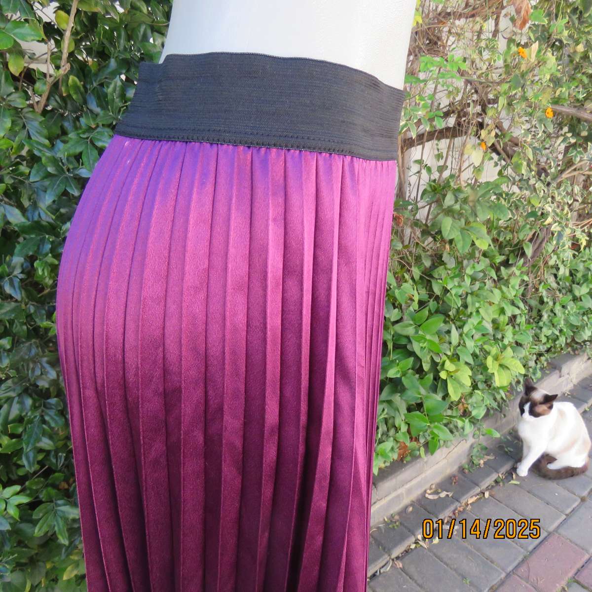Amazing plum colour silky polyester perm. concertina pleated skirt.Black elastic waistband.Size 36