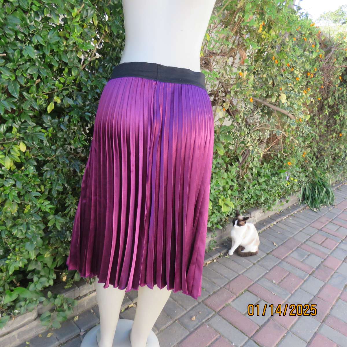 Amazing plum colour silky polyester perm. concertina pleated skirt.Black elastic waistband.Size 36