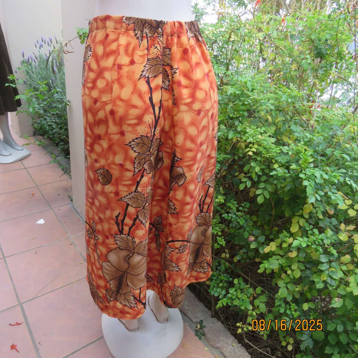 Owner made 2 pc skirt-top outfit in burnt orange and brown. Size 44.