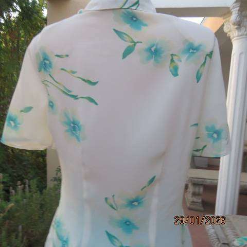 MILADYS white with jade floral print soft polyester button down open collar top. Size 34