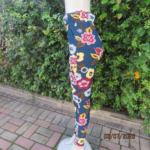 Navy stretch polyester skinny floral pants side pockets and elastic waist, size 34
