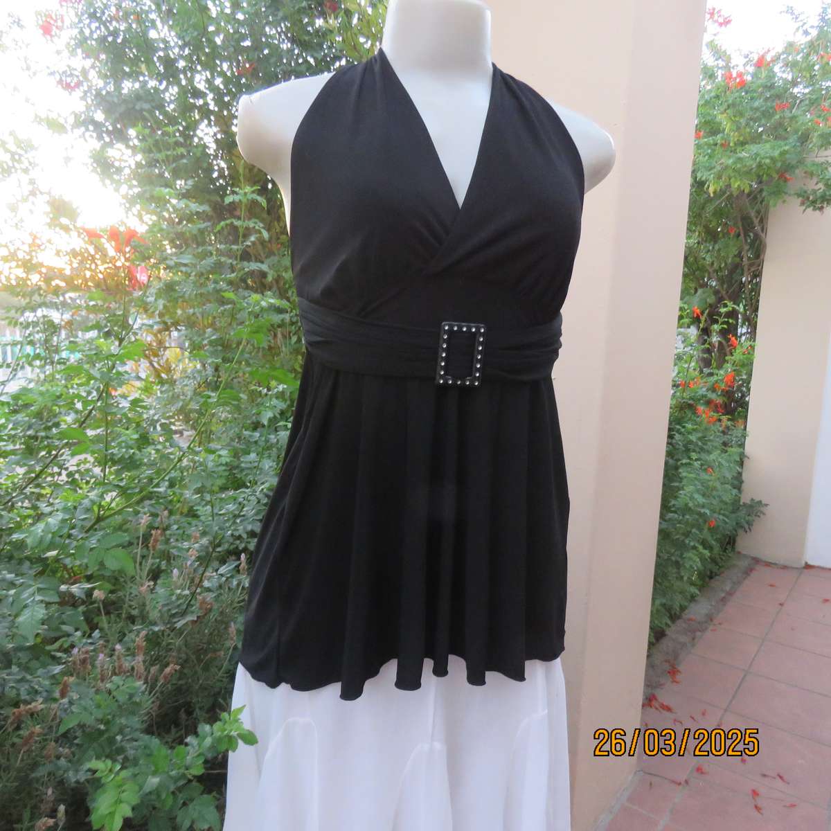 Very black stretch polyester halter neck evening top. Gathered front band with buckle. Size 30