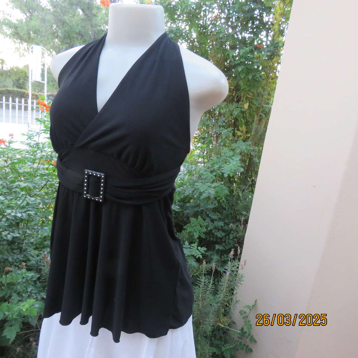Very black stretch polyester halter neck evening top. Gathered front band with buckle. Size 30