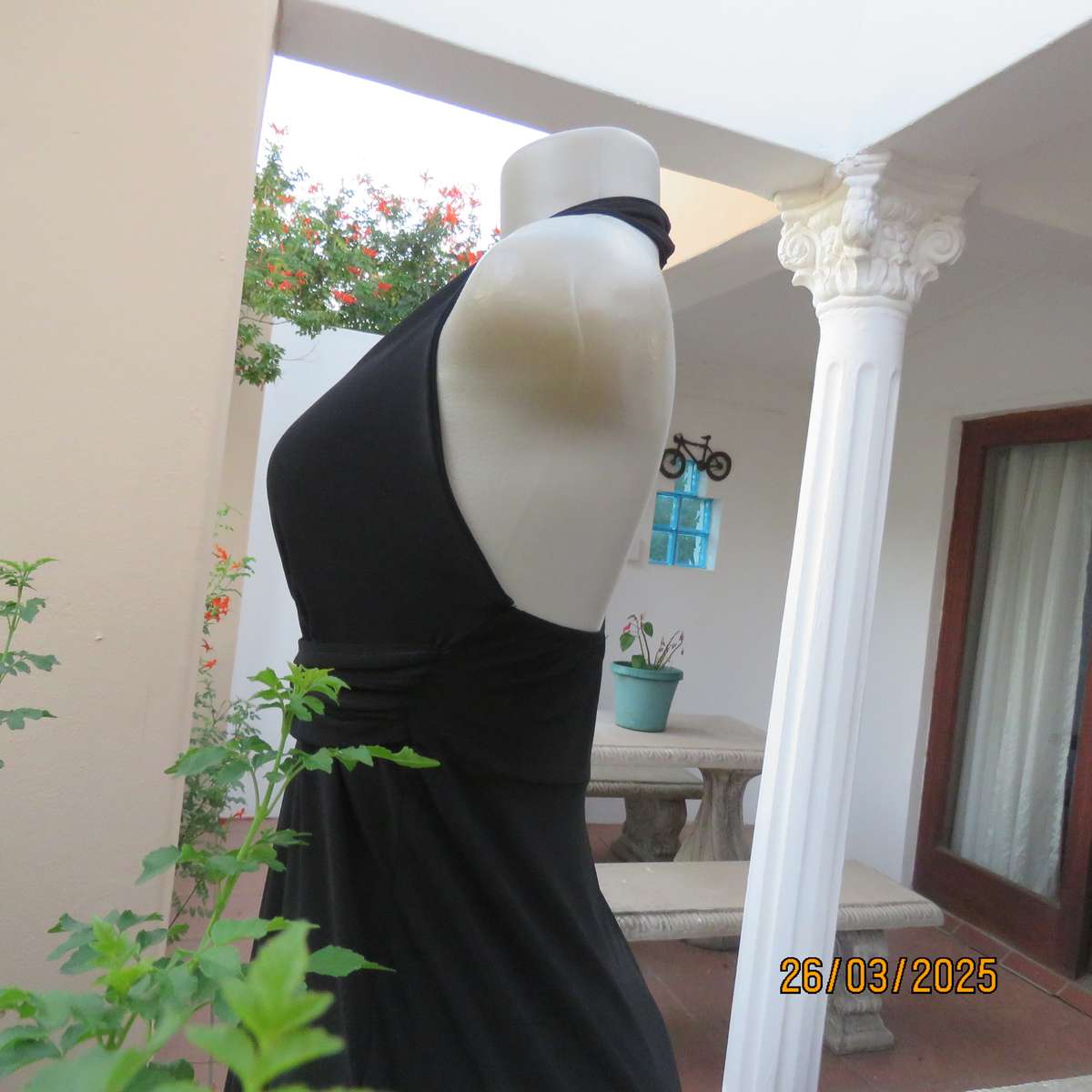 Very black stretch polyester halter neck evening top. Gathered front band with buckle. Size 30