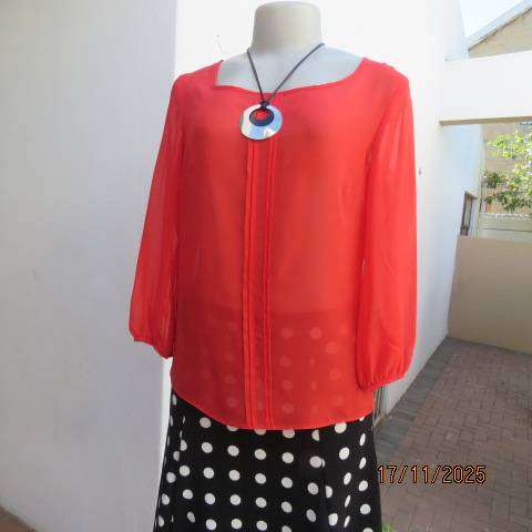 FASHION Express size 34 red sheer polyester slip over long sleeve top.