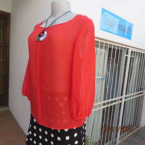 FASHION Express size 34 red sheer polyester slip over long sleeve top.