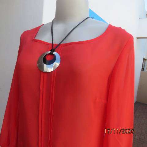 FASHION Express size 34 red sheer polyester slip over long sleeve top.