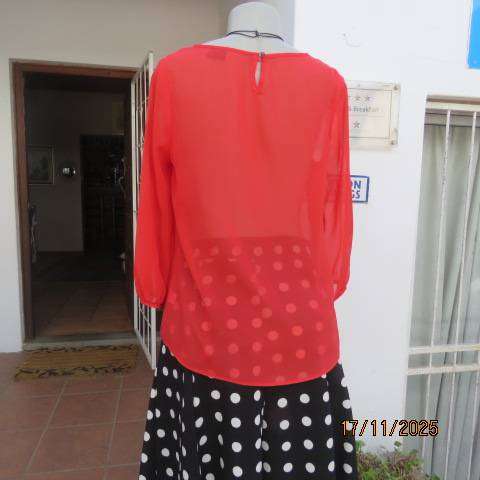 FASHION Express size 34 red sheer polyester slip over long sleeve top.