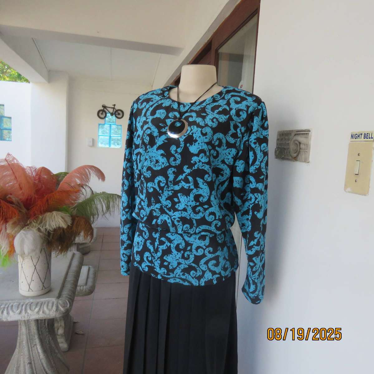 KRESIV peplum style black silky polyester with jade print top. Size 40