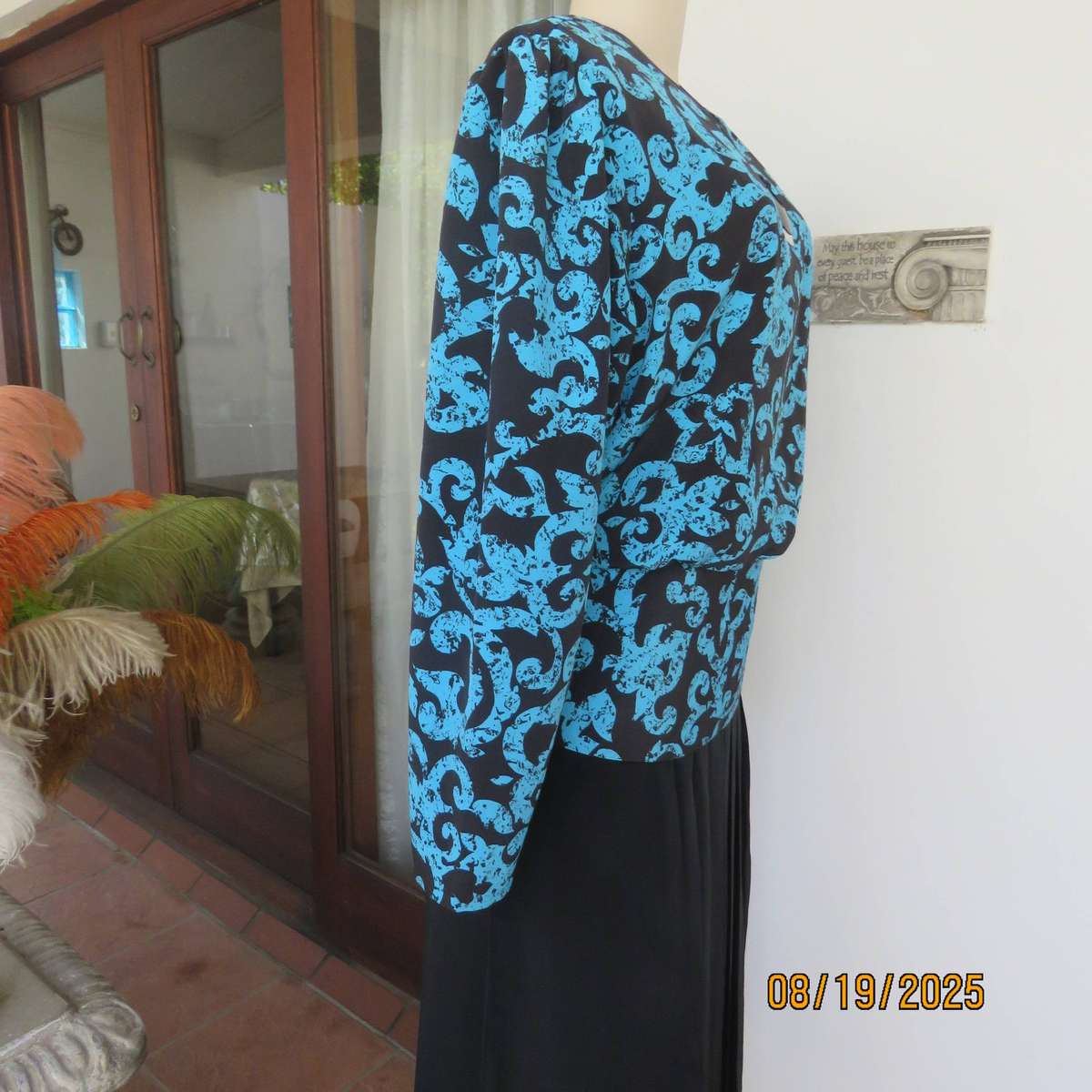 KRESIV peplum style black silky polyester with jade print top. Size 40