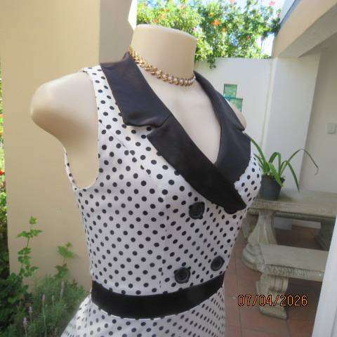 WWW white and black polkadot shiny polycotton stretch peplum top with long back zip, size 30