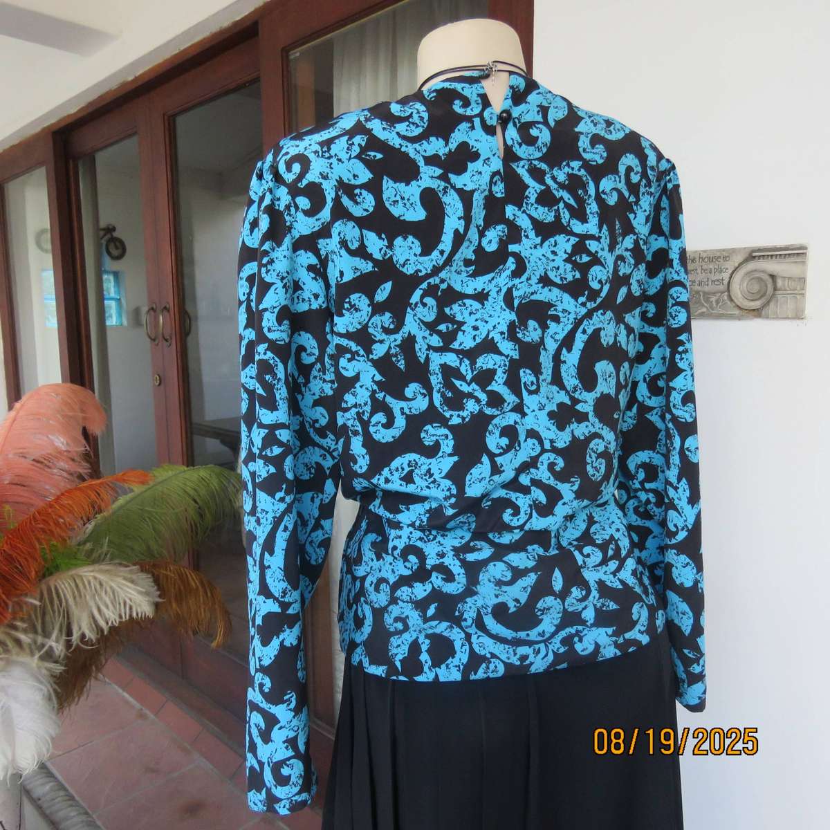 KRESIV peplum style black silky polyester with jade print top. Size 40