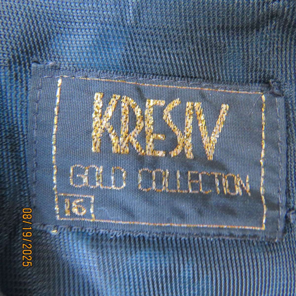 KRESIV peplum style black silky polyester with jade print top. Size 40