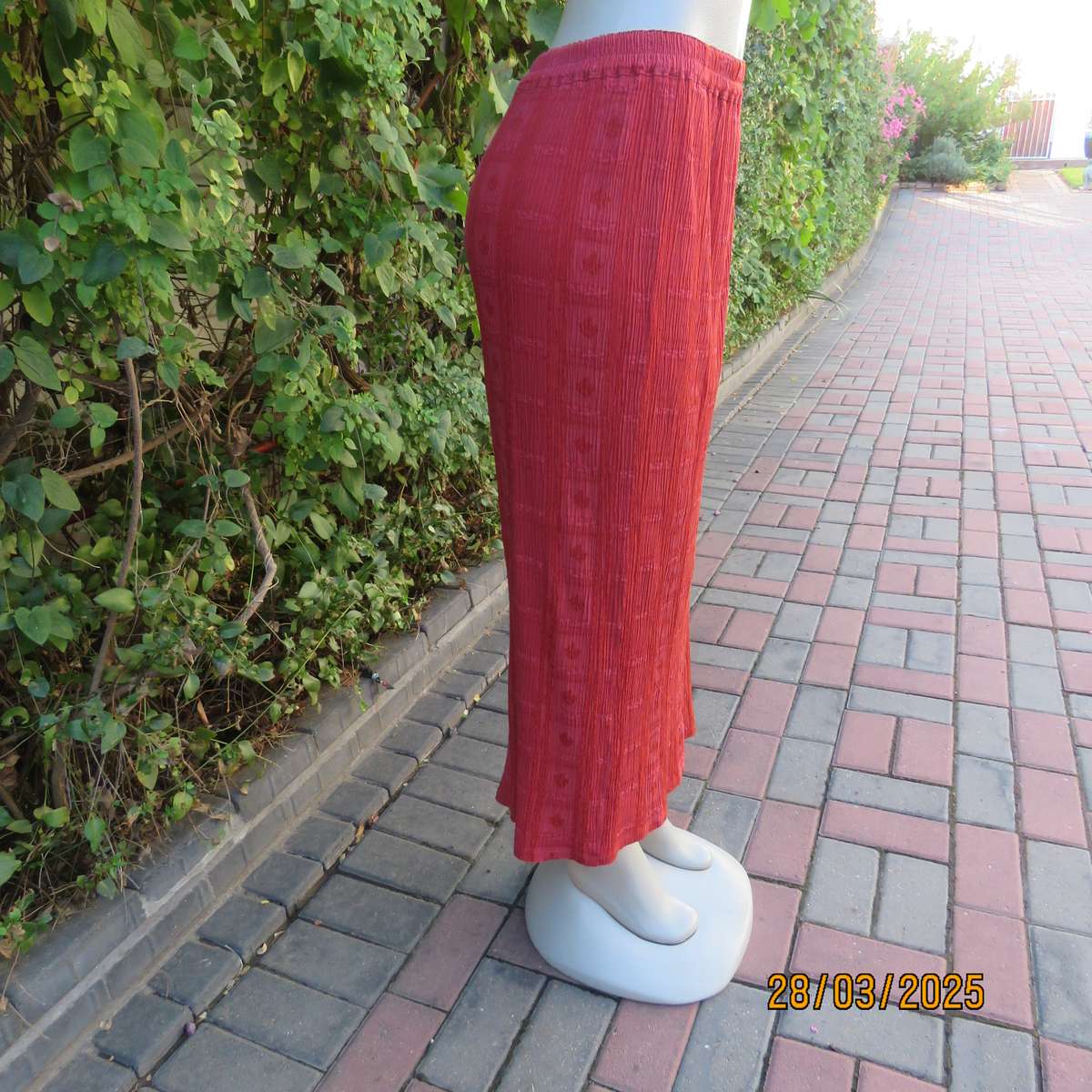 Burnt orange colour ankle length crinkled polycotton size 36 skirt with  embossed patterns.
