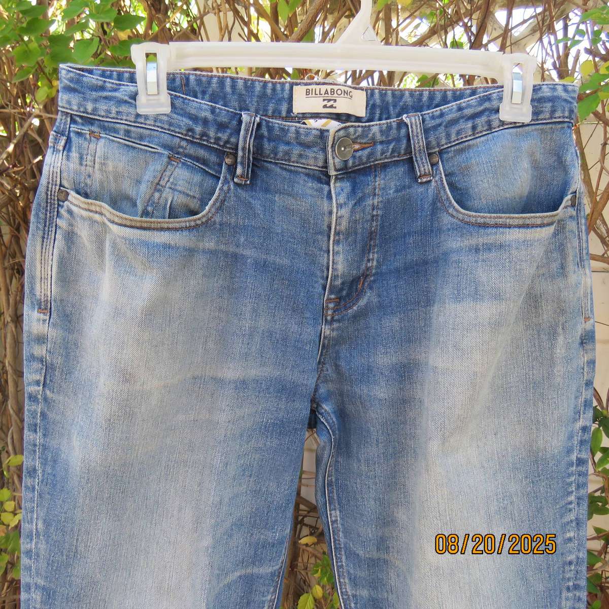 BILLABONG blue denim stretch polycotton jeans size 40 worn by lady.