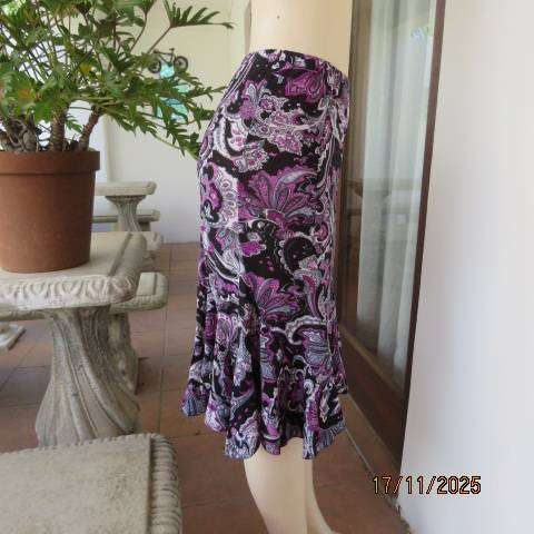 Soft stretch polyester black rounded paneled skirt with pink-white bo-ho print. Size 35