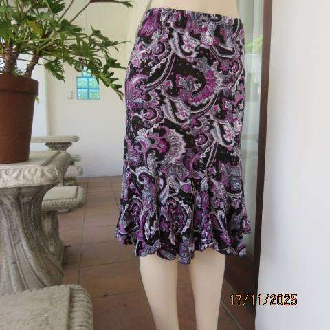 Soft stretch polyester black rounded paneled skirt with pink-white bo-ho print. Size 35