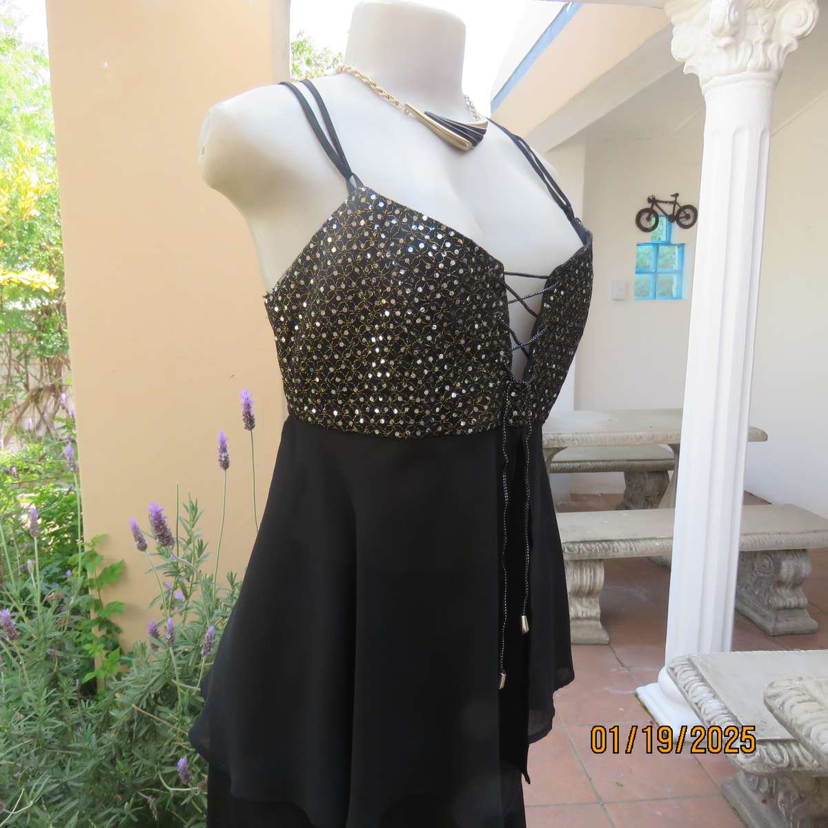 Black polyester evening top with sequined bodice. Empire style. Size 34
