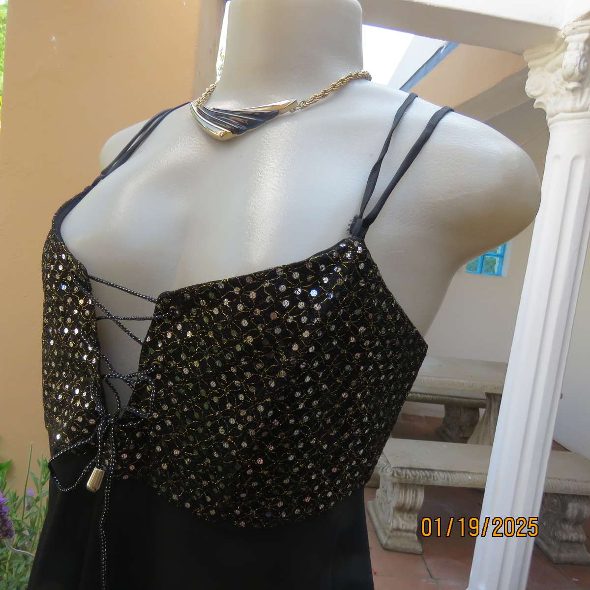 Black polyester evening top with sequined bodice. Empire style. Size 34