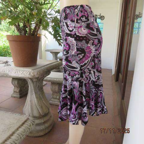Soft stretch polyester black rounded paneled skirt with pink-white bo-ho print. Size 35