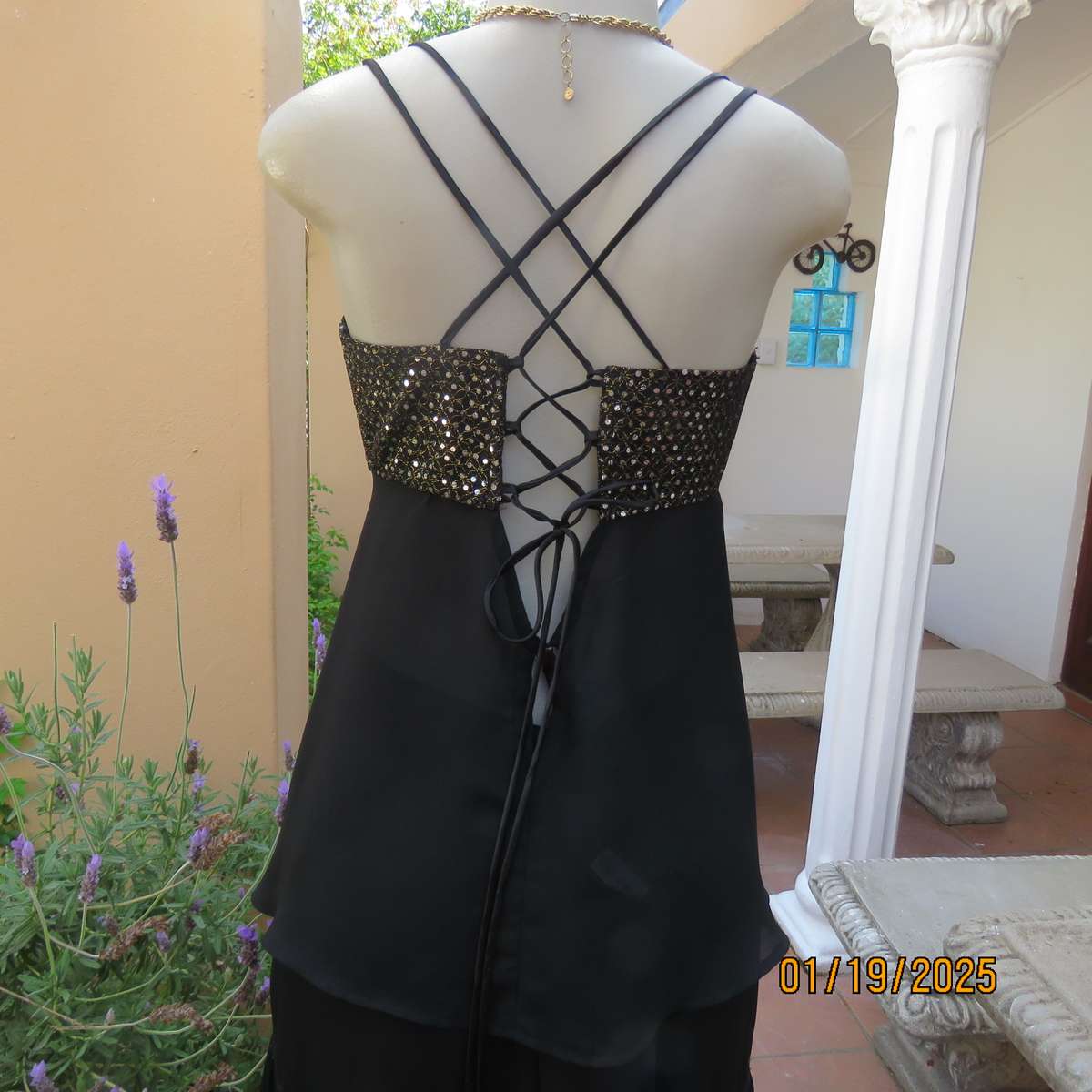 Black polyester evening top with sequined bodice. Empire style. Size 34