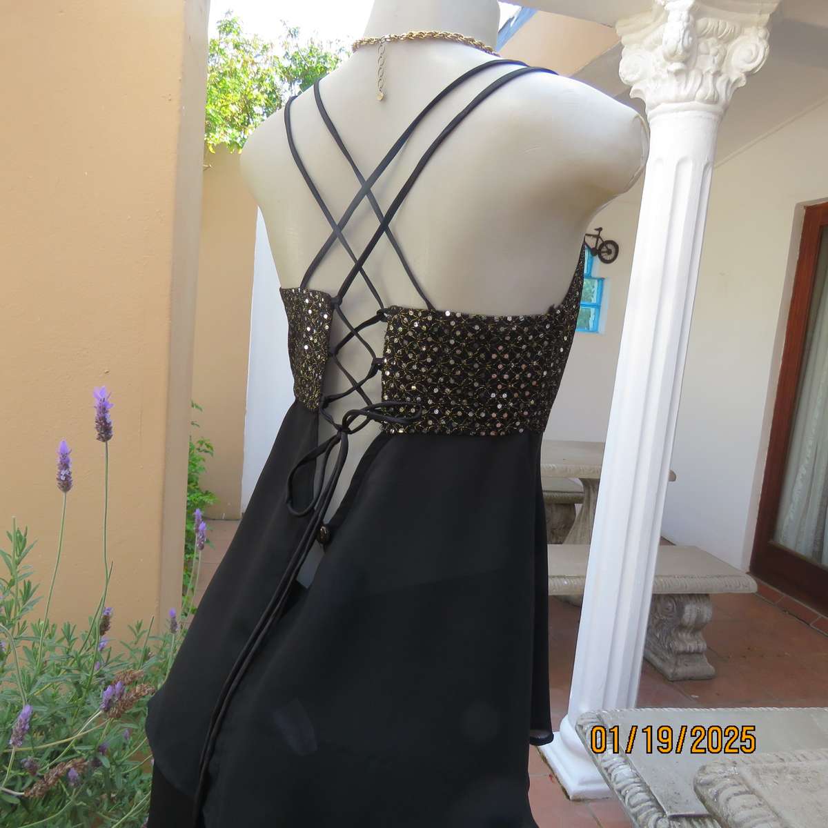 Black polyester evening top with sequined bodice. Empire style. Size 34