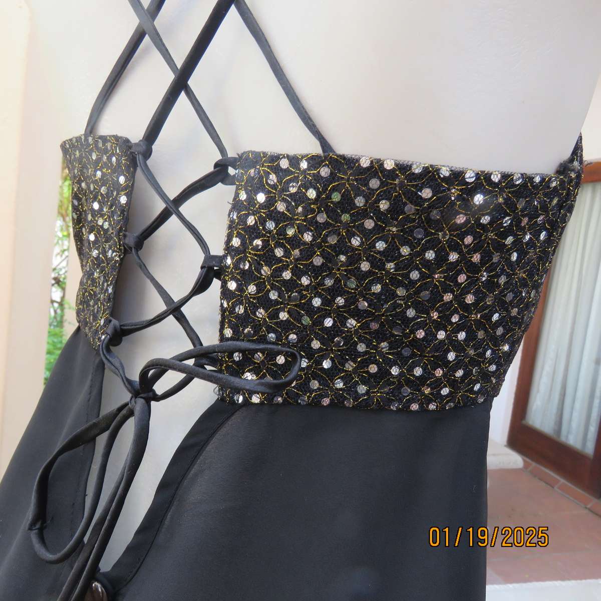 Black polyester evening top with sequined bodice. Empire style. Size 34