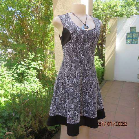 OR black stretch polyester sleeveless dress with black-white poly floral lace overlay. Size 32