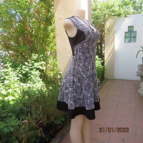 OR black stretch polyester sleeveless dress with black-white poly floral lace overlay. Size 32