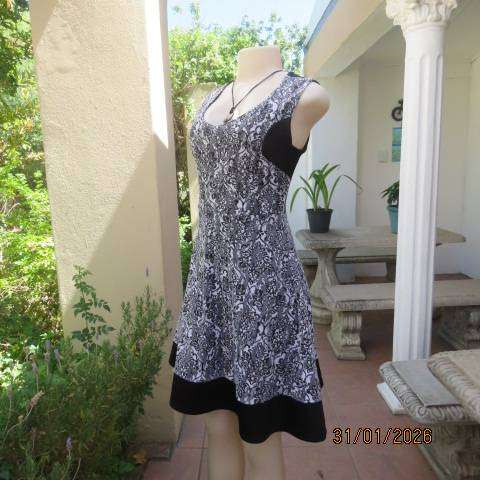 OR black stretch polyester sleeveless dress with black-white poly floral lace overlay. Size 32