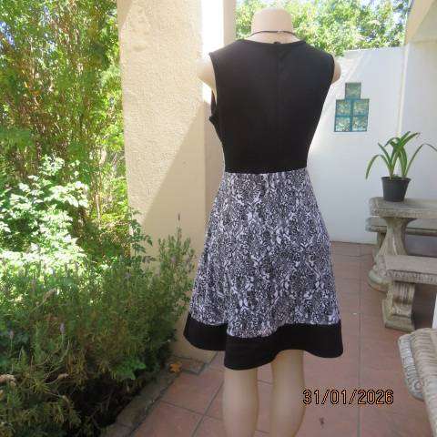 OR black stretch polyester sleeveless dress with black-white poly floral lace overlay. Size 32