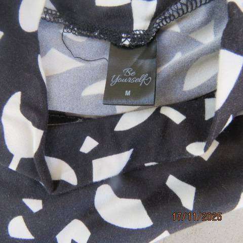 Monochrome long sleeve tiered dress with graphic print in soft stretch polyester. Size 38