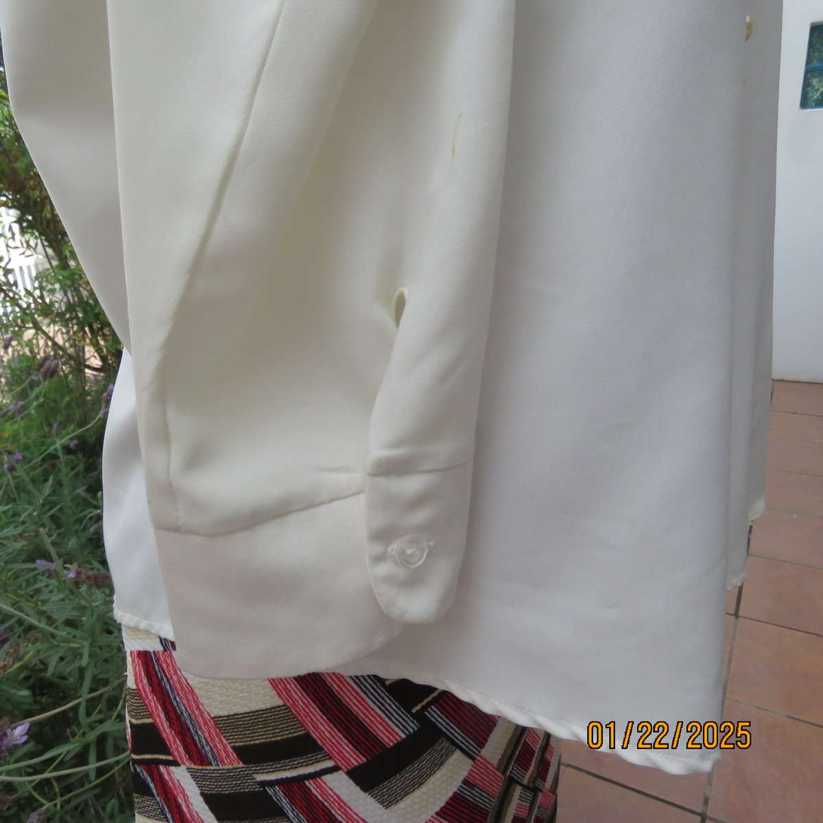 Smart light cream long cuffed sleeve polyester top size 38-40. Hidden button down.Open collar.As new