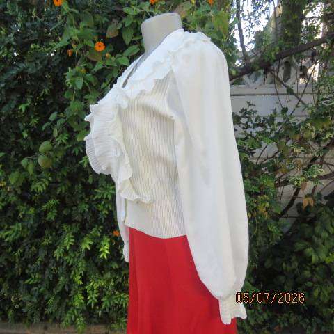 M M elegant off white long polyester puffed sleeve top with acrylic knit body and frills, size 36
