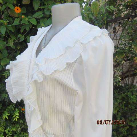 M M elegant off white long polyester puffed sleeve top with acrylic knit body and frills, size 36