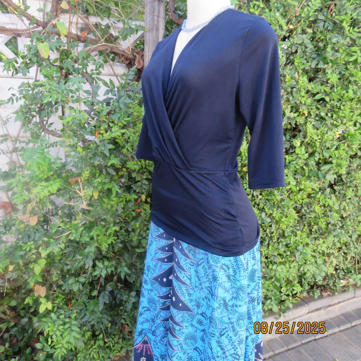 Navy stretch polyester peplum slip over top size 34. cross over bust.