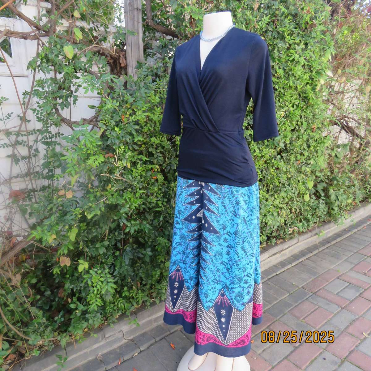 Navy stretch polyester peplum slip over top size 34. cross over bust.