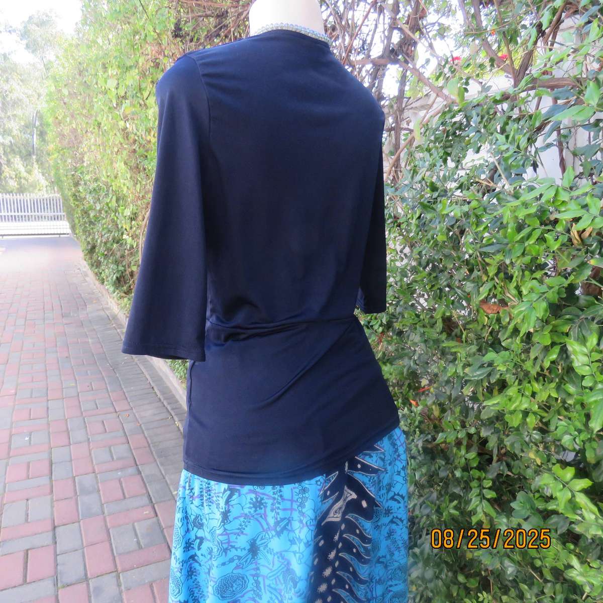 Navy stretch polyester peplum slip over top size 34. cross over bust.