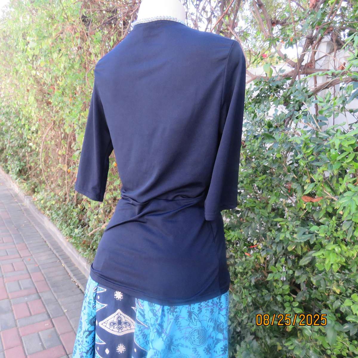 Navy stretch polyester peplum slip over top size 34. cross over bust.